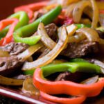 Sizzling Steak Fajitas: Peppers, Onions, and Flavor Burst