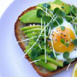Wholesome Creamy Avocado Egg Toast Topped with Microgreens