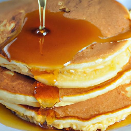 Golden Cornmeal Pancakes Drizzled with Sweet Maple Syrup